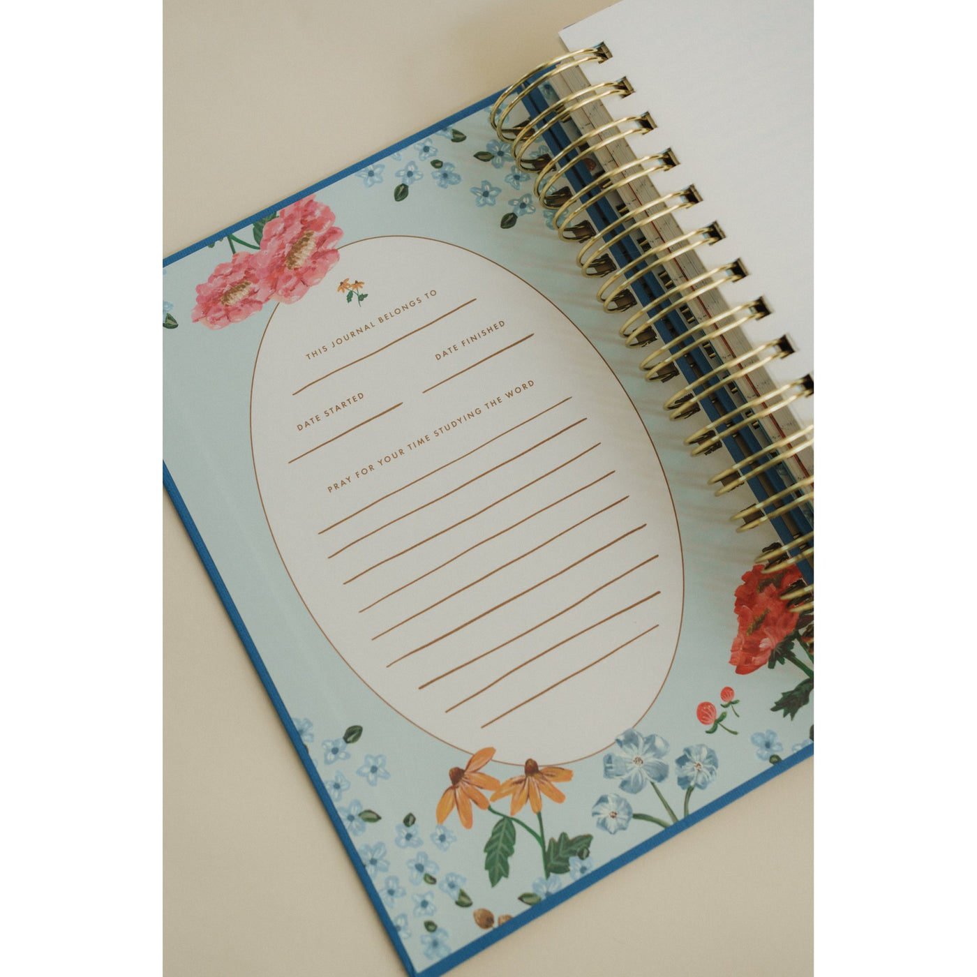 Close-up of the ownership page inside the Give Me Jesus Journal with floral illustrations and space to record start and finish dates.