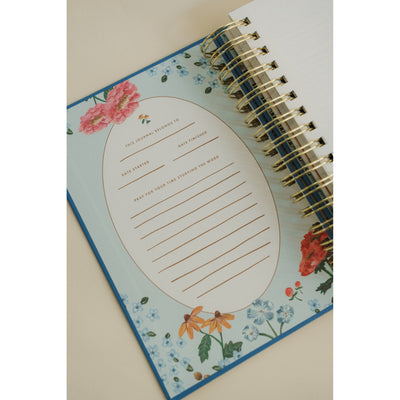 Close-up of the ownership page inside the Give Me Jesus Journal with floral illustrations and space to record start and finish dates.
